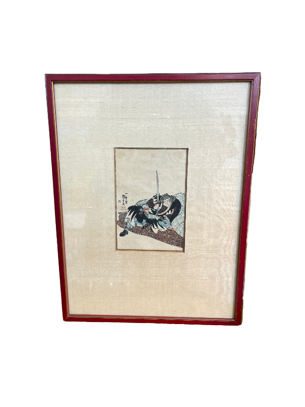 Framed picture of a person on a wall with wooden frame and decorative wallpaper.
