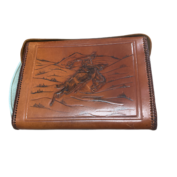 Brown leather wallet with embossed design of a horse and rider on a white background