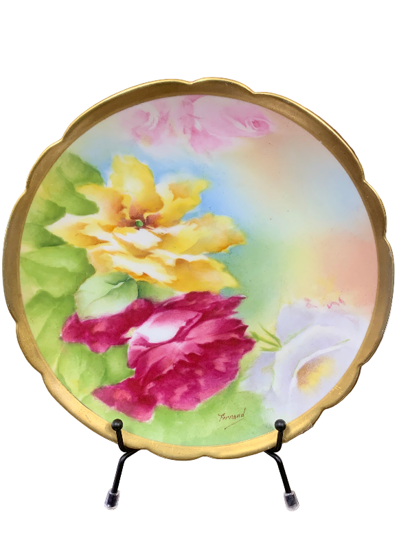 Decorative plate with floral design on a stand 