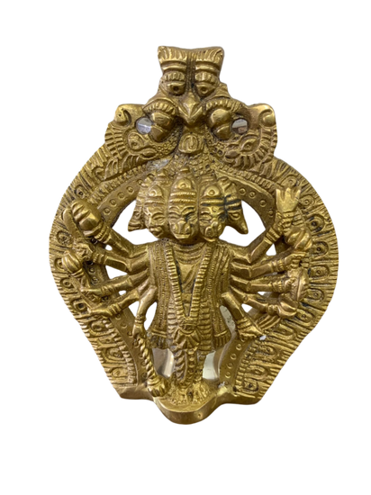 Gold-colored metal deity figurine with multiple arms 