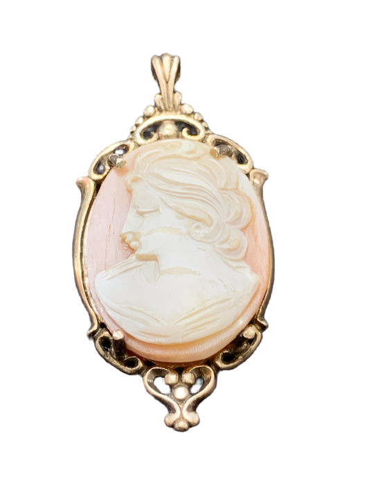 Cameo pendant with gold tone frame